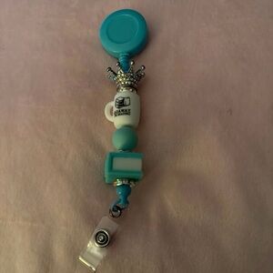 Blue Beaded Badge Reel with Crown and Mug Charms